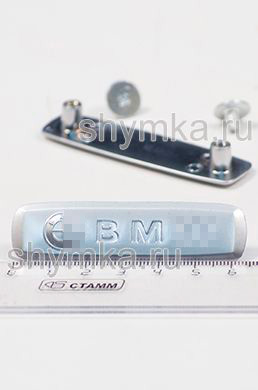 Шильдик металлический МАТОВЫЙ 
для автоковриков BM... + 2 болтика