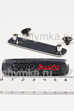 Шильдик металлический ГЛЯНЕЦ 
для автоковриков AUD... ЦВЕТНОЙ + 2 болтика